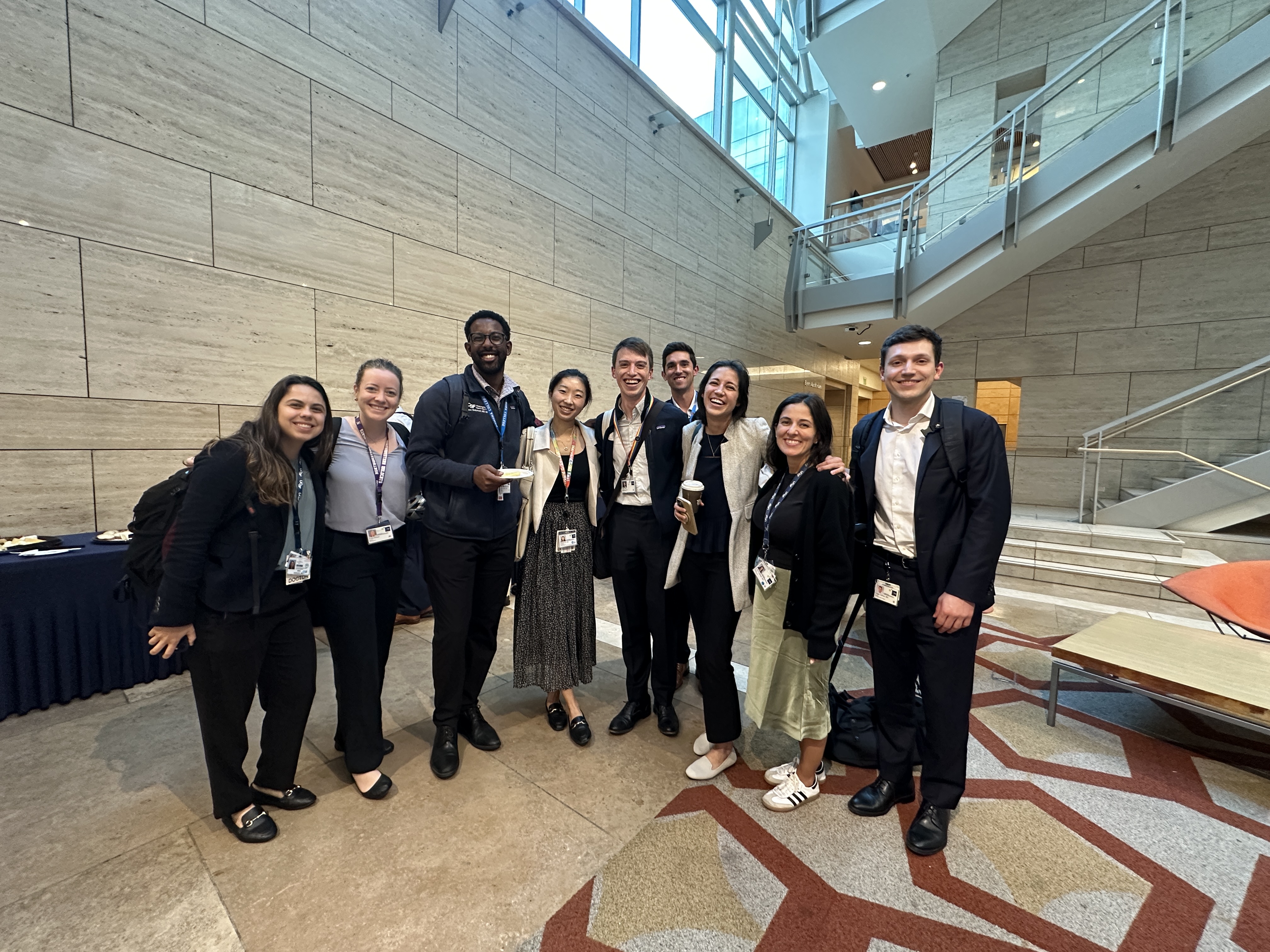 Attendees of the Boles Lectureship pose for a group photo in a building lobby.
