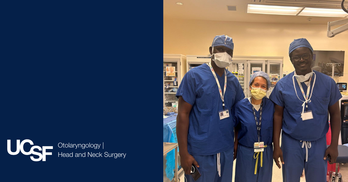 Dr. Lia Jacobson stands in between two doctors after a patient surgery.