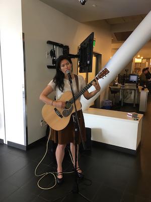 Ellisa Sun playing guitar